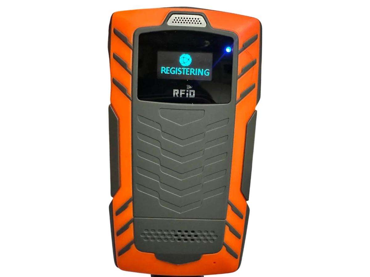 The patrol reader powered on, its screen reading REGISTERING